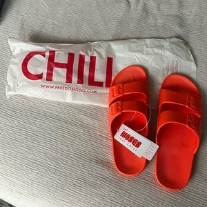 NWT and bag Freedom Moses “Lucy” sandals in red/orange. Size 40/41